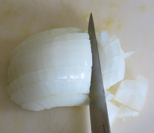chopping an onion with a knife