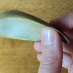 holding an artichoke leaf