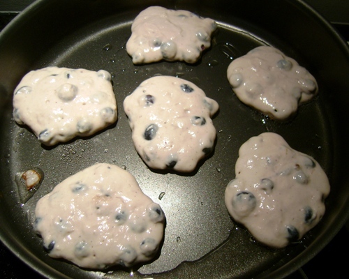 blueberry pancake batter in the frying pan