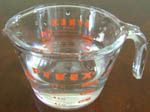 water in a glass pyrex measuring cup