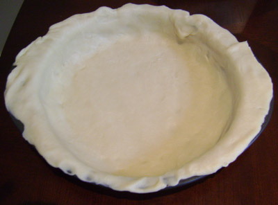 Bottom crust dough for blueberry pie put on the bottom and sides of the baking dish