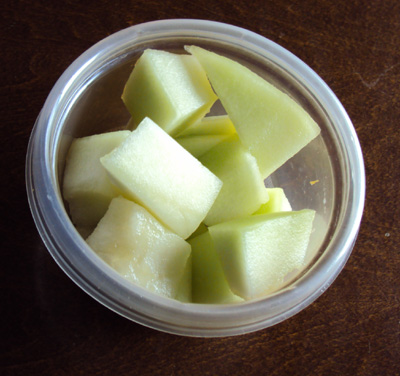 how to cut a melon - melon chunks in a bowl