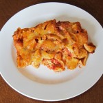 baked pasta shells casserole on a white plate