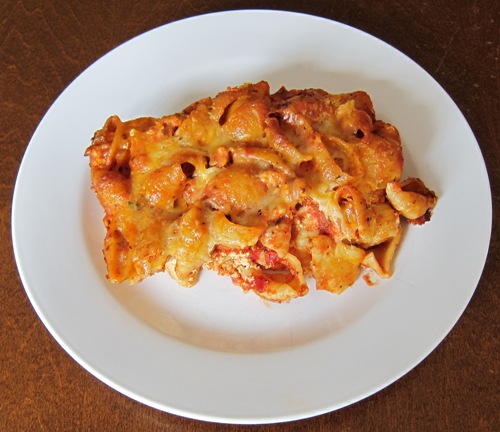 baked pasta shells casserole on a white plate