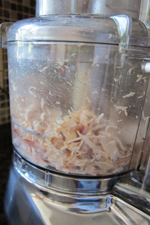 shredded chicken inside the food processor bowl