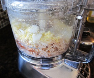 chopped eggs and chicken inside food processor