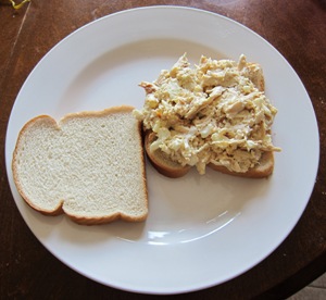 slice of bread spread with a chicken salad