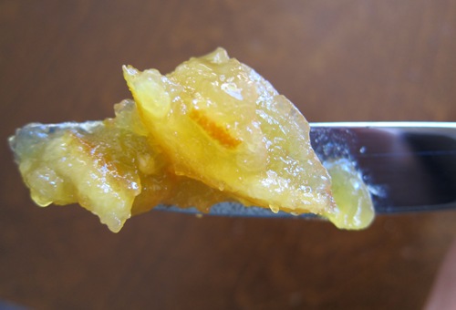 orange marmalade spread with a knife