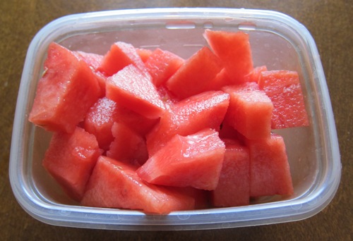 watermelon chunks in a plastic bowl