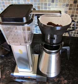open coffee basket in the coffee maker