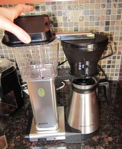 open lid on coffee maker to pour water