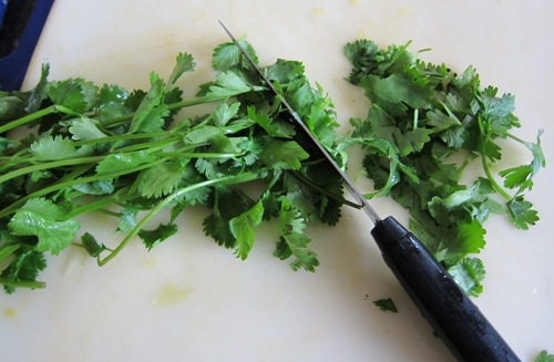 knife chopping the cilantro