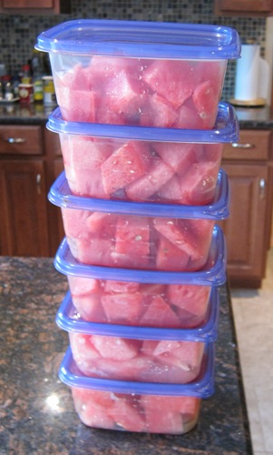 stack of containers of watermelon chunks