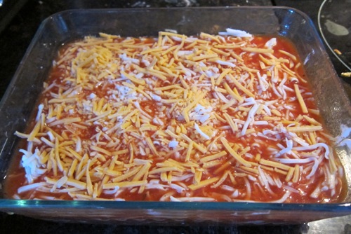 sprinkle lasagna with shredded cheese
