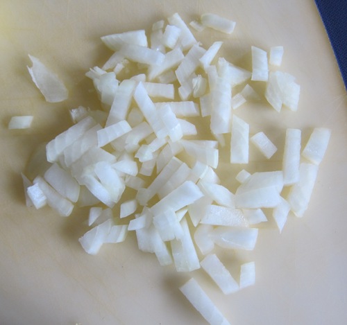 chopped onion on a cutting board