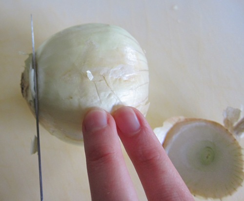 cutting off the second end of the onion