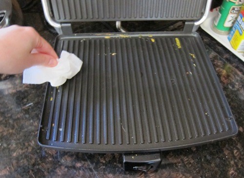 cleaning a panini press with a paper towel