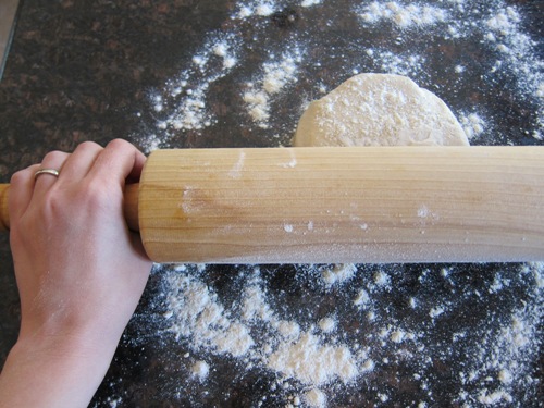 rolling the dough with a rolling pin