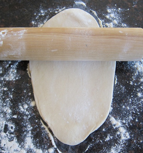 rolling dough into an oval