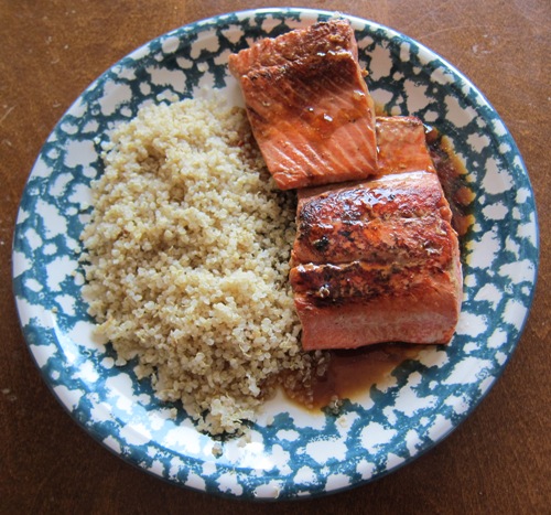 salmon teryaki on a plate served with quinoa