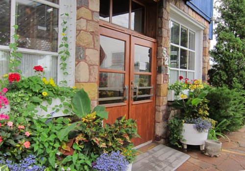 the cheese factory restaurant front door and garden