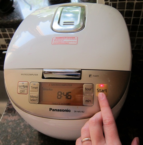 press the start button on the rice cooker