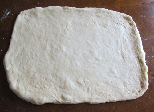 cinnamon rolls dough rolled into rectangle