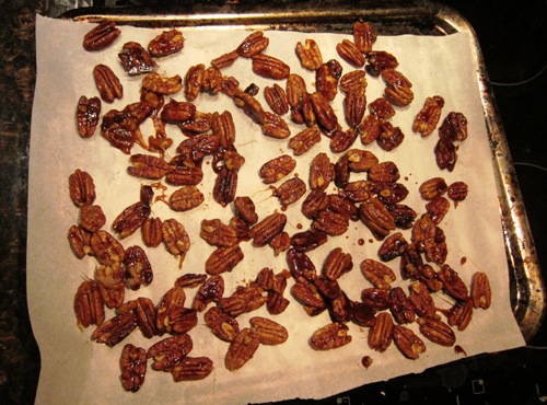 candied nuts drying on parchment paper