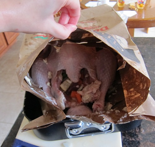 making turkey in a brown paper grocery shopping bag - going in the oven