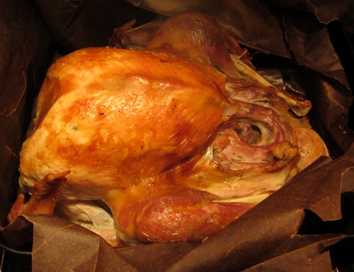 thanksgiving roast turkey in a brown bag