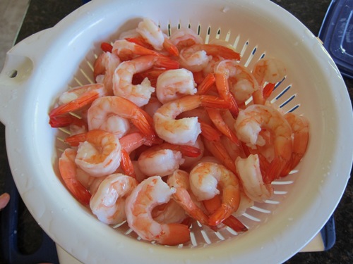 defrost shrimp in a colander