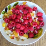 cottage cheese with raspberries peaches and walnuts