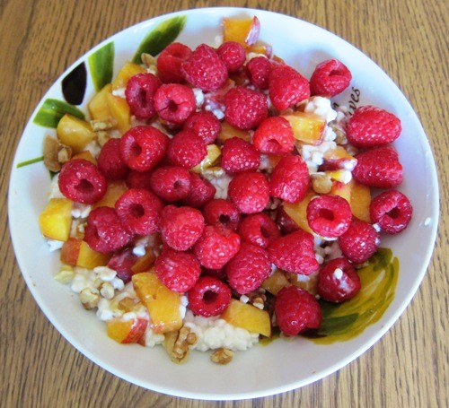 cottage cheese with raspberries peaches and walnuts