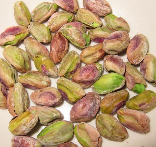 green pistachios nuts closeup