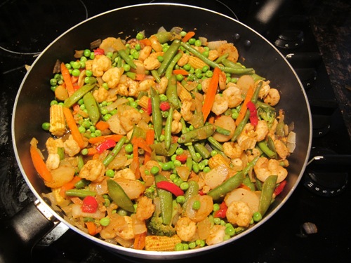 shrimp stir fry on a frying pan