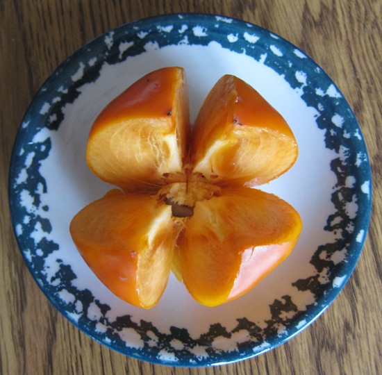 persimmon cut into quarters for eating