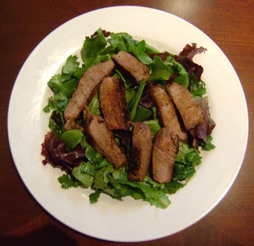 grilled slices steak and green lettuce salad recipe