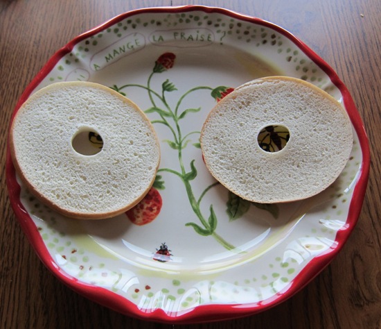split toasted bagel thin on a plate