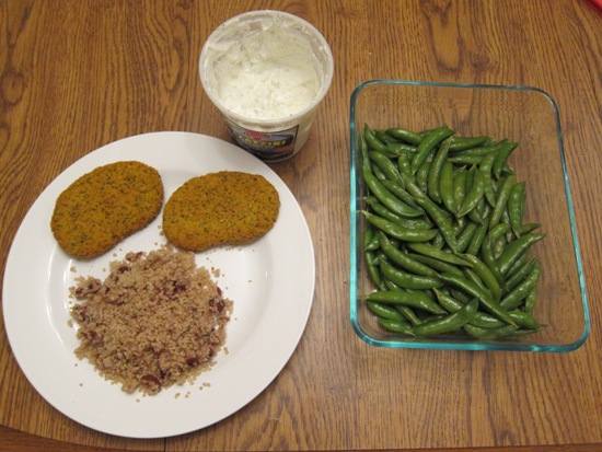 Vegetarian Dinner Of Veggie Patties, Quinoa, Tzatziki Sauce And Garlic Sugar Snap Peas