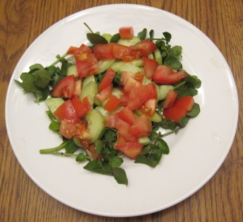 watercress salad on a plate