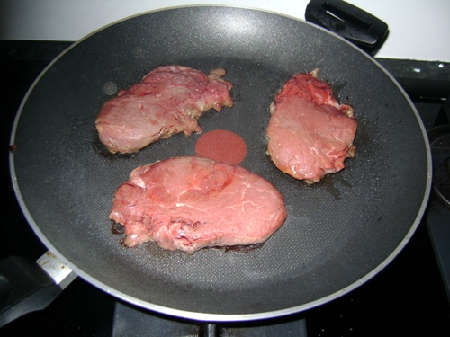 cooking filet mignon on a frying pan