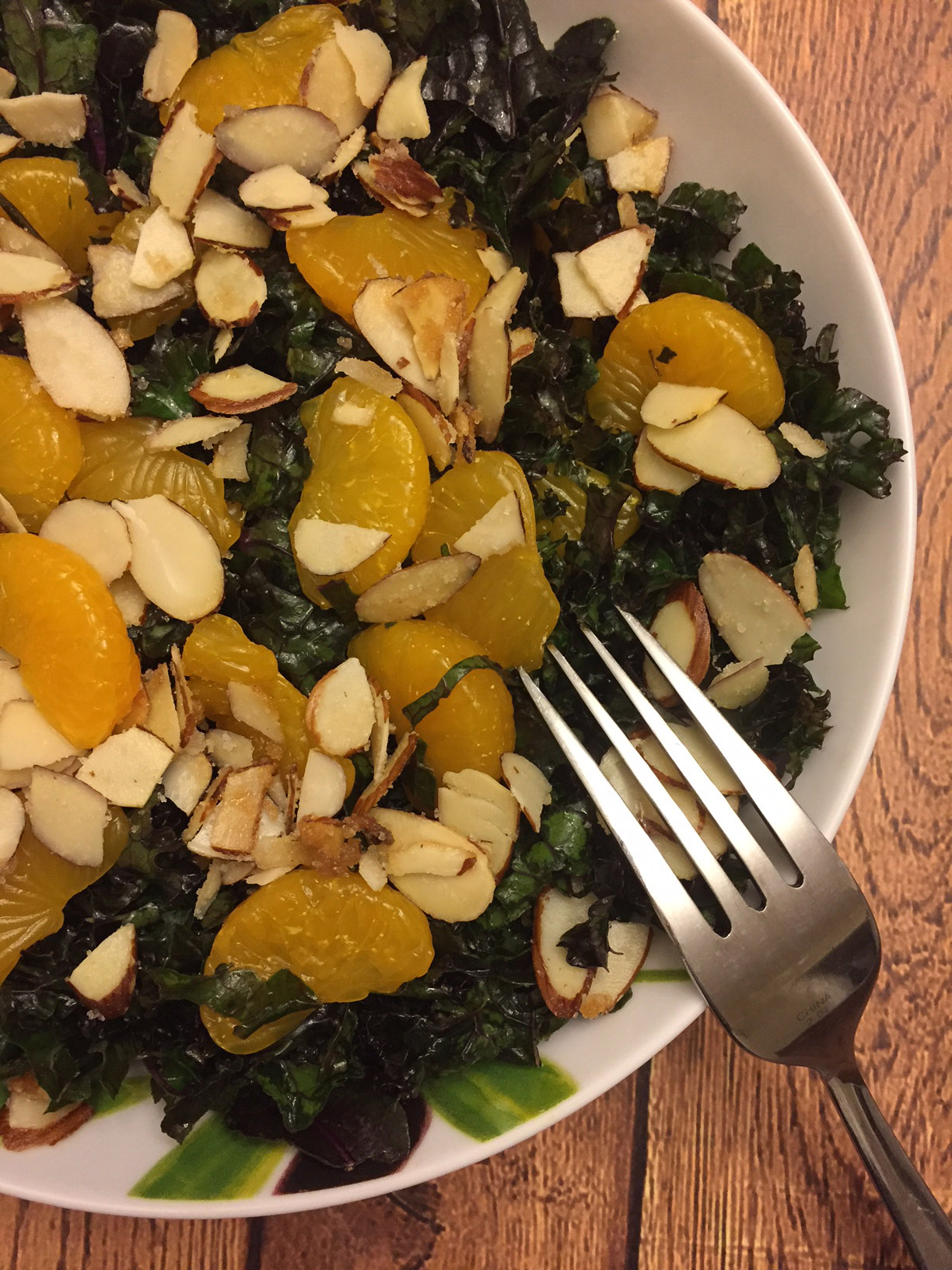 Red Kale Salad Recipe With Orange Slices And Slivered Almonds