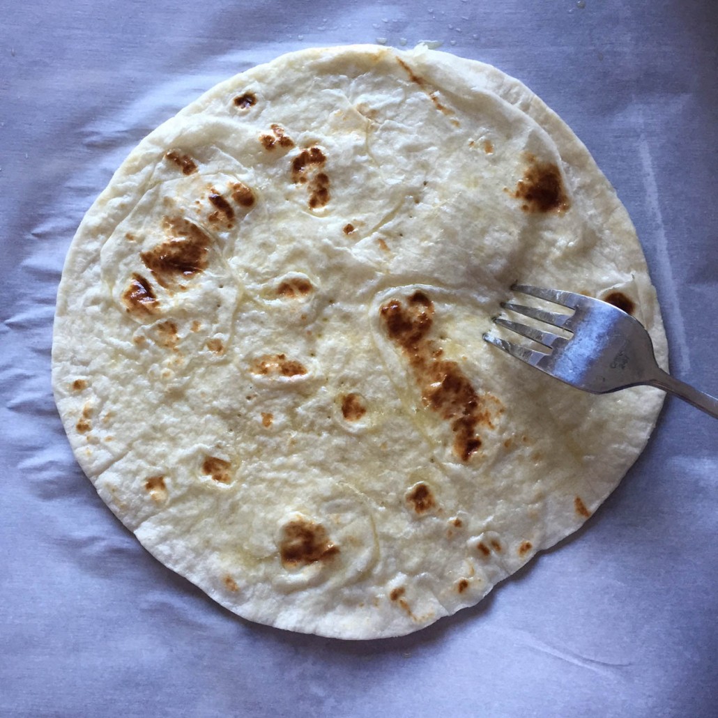 Pricking tortilla with a fork
