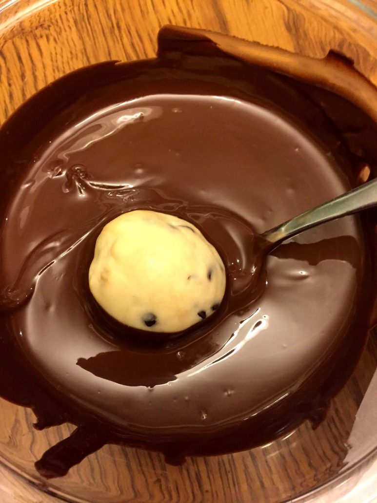 Dipping Cookie Dough Truffles In Melted Chocolate