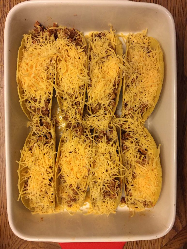 Baked tacos with shredded cheese