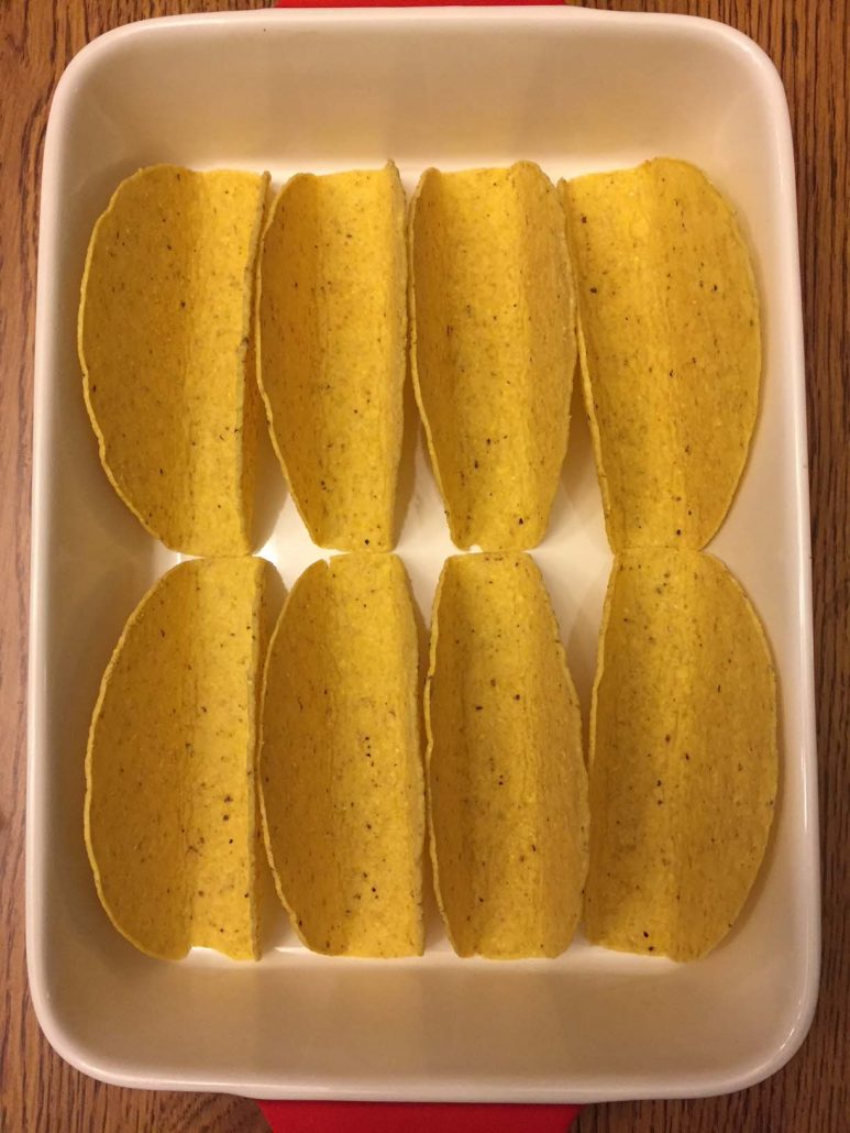 Taco shells in a baking dish