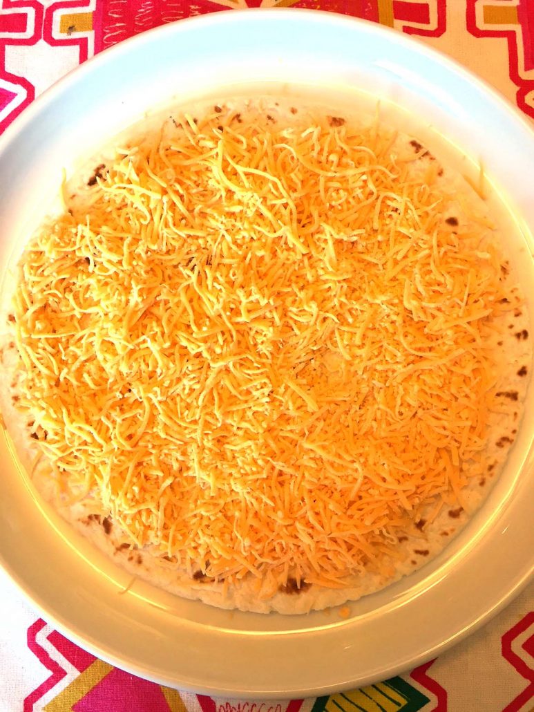 Tortilla with shredded cheese