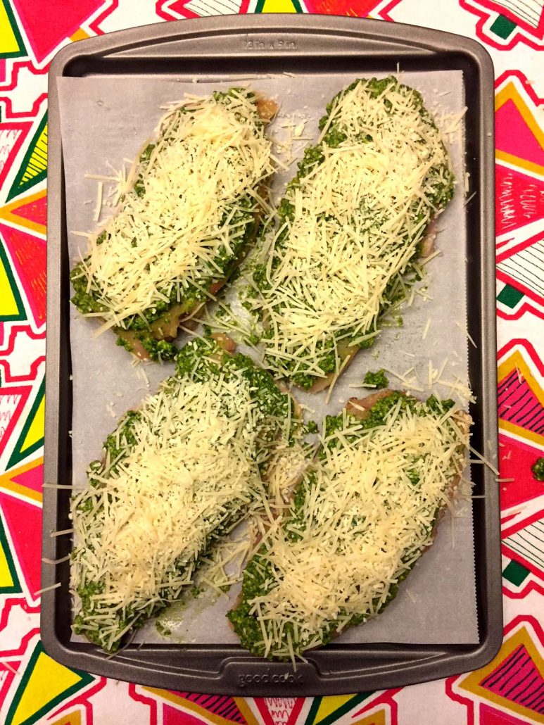Pesto chicken sprinkled with Parmesan cheese