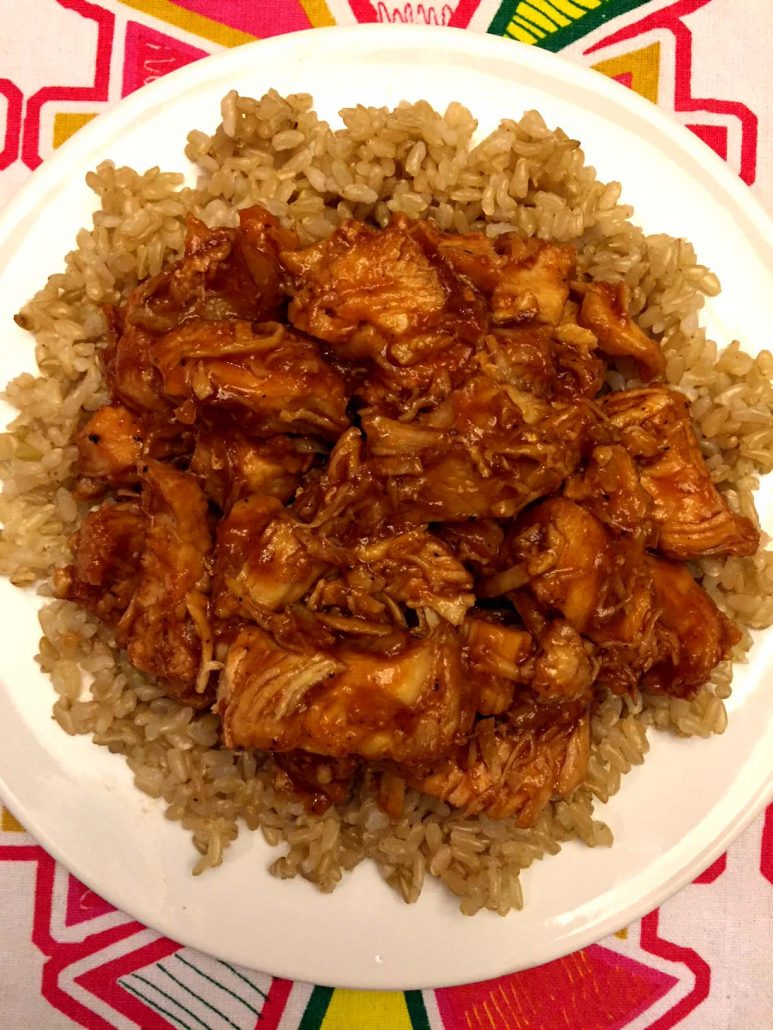 Plate of BBQ chicken served over rice