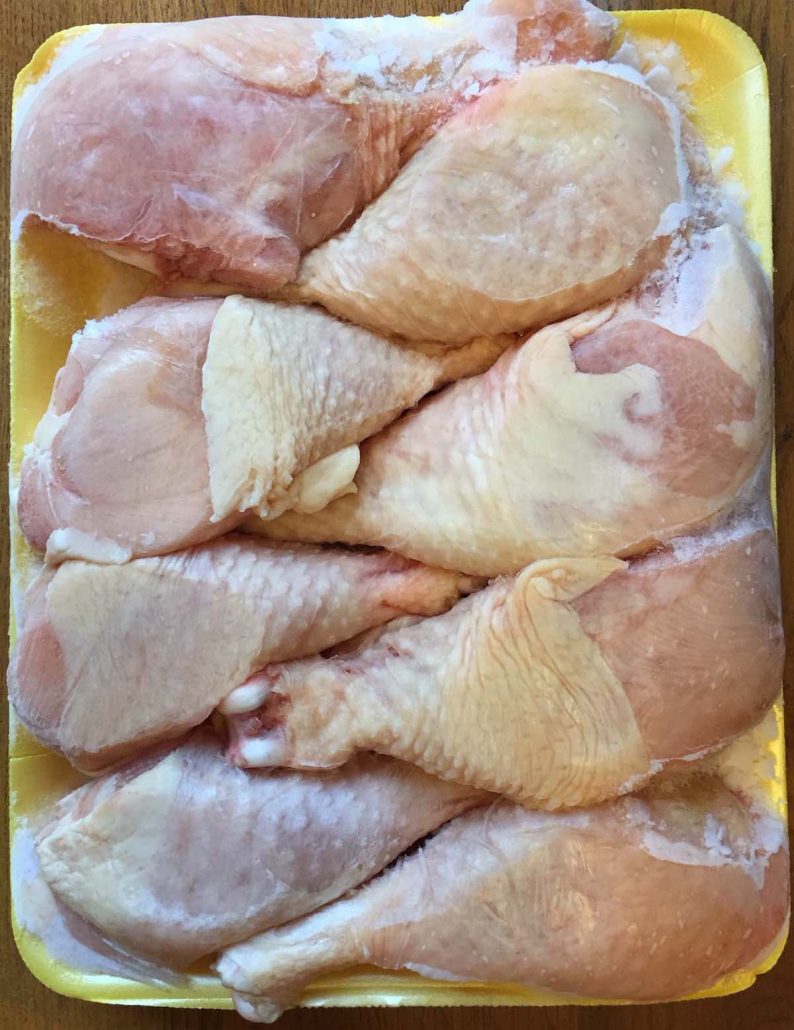 A Block Of Frozen Chicken Legs